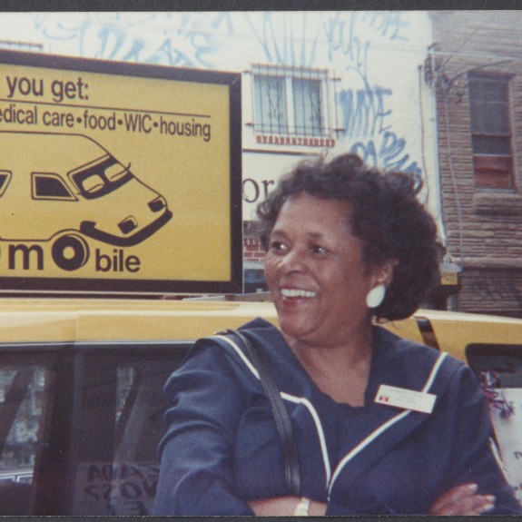 Photo from 1980s with MCC staff member outside with van