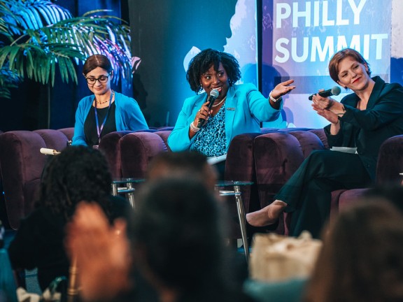 three women on a stage