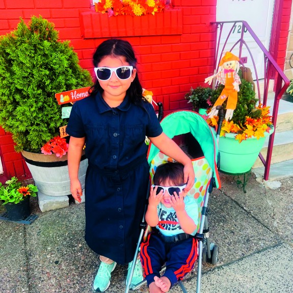Two children wearing sunglasses