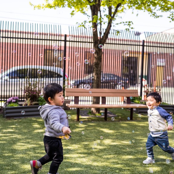 Kids chasing bubbles