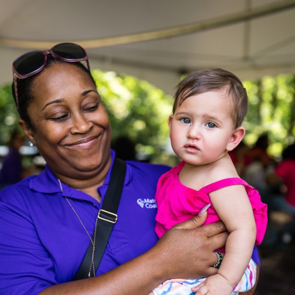 MCC Advocate holding baby