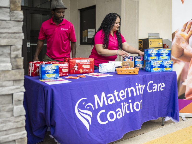 woman and man fixing menstrual products on the table