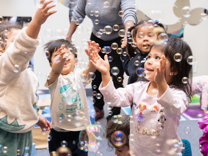 Children Playign with bubbles