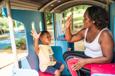 Mom and child high five