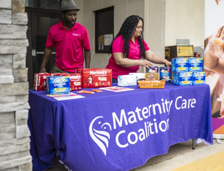 woman and man fixing menstrual products on the table