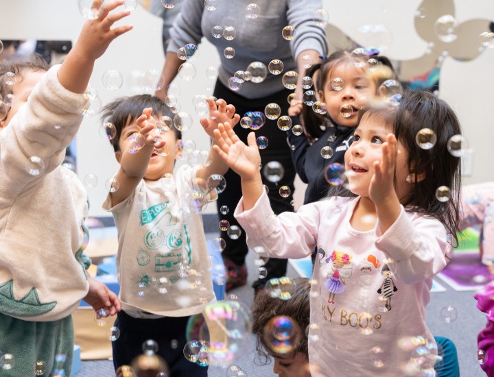 Children Playign with bubbles